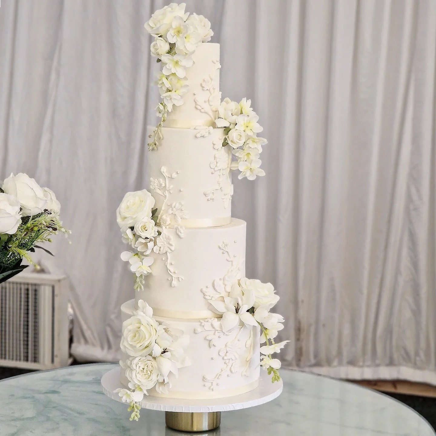 White floral wedding cake in the atelier
