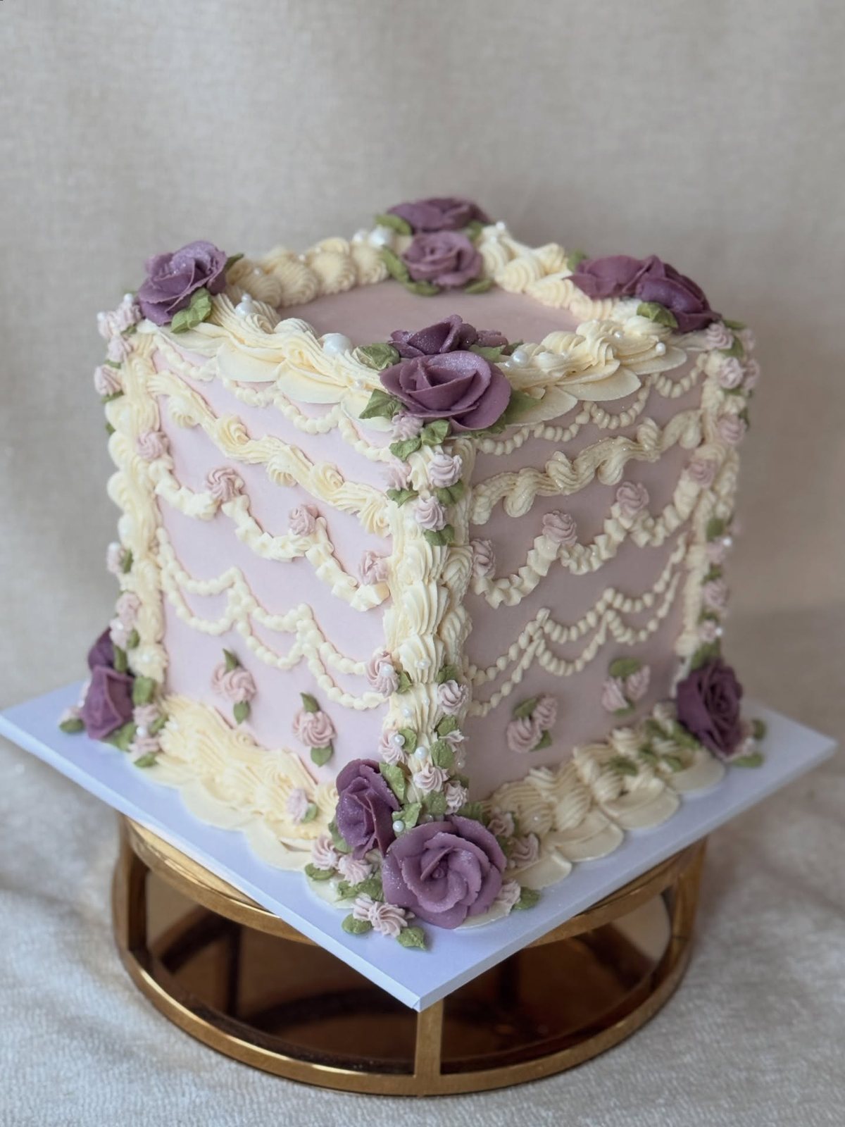 Lilac square cake with vintage piping and roses